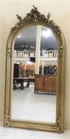 Cherub Crowned Gilt Framed Arch Beveled Mirror.