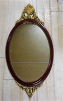 Gilt Accented Oval Mirror.