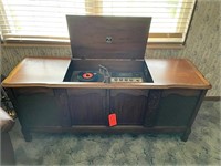 Vintage RCA Victor record player in cabinet