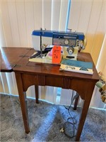 Zig-Zag sewing machine in cabinet