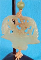 696 - CARVED, TASSEL ASIAN FIGURE ON STAND (N103)
