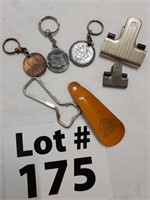 Assorted keychains, bottle opener, shoe horn, and