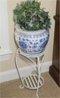 blue white fishbowl planter & a wrought iron stand