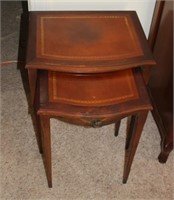 two leather top nesting tables