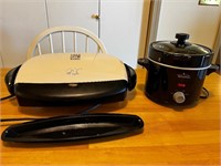 George Foreman and rival crockpot