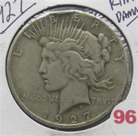 1927 Peace Silver Dollar. Rim Damage.