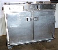 #1 Food Warming Equip Mdl PTST-0911-36HC Heated Tray Delivery Cart (L side heats, R side is non-heated), 45 1/2" h x 52" w x 26 1/2" d.  This unit was used at a correctional facility to transport meals to inmates. Tested/works