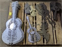 Pallet lot of bare metal wall art, including
