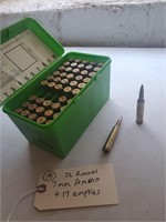 32 rounds 7mm ammo + 17 empties