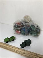 Lot of 2 metal military vehicles and bag of