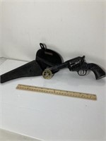 Vintage toy gun and badge