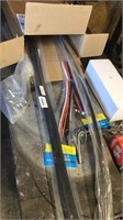 Box of car parts (tubing, lights, filters)