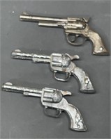 Three Smoky & Pet Cap Guns
