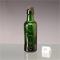 Antique R.W. & S.L. White advertising green bottle