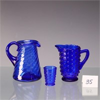 Two vintage cobalt blue creamer and shot glass and