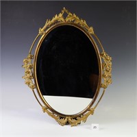 Antique brass oval mirror with foliate and floral