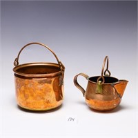 Two hand wrought copper pieces with handles
