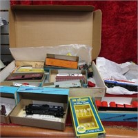 Vintage HO Scale train cars, engine, signs.