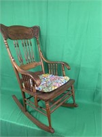Oak rocking chair with quilted pad