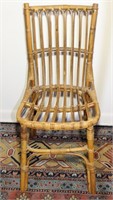 a mid century rattan side chair 36"h x 16w x 20.5d