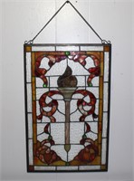 stained glass panel of a torchier 20.75h x 13.25w