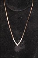 A DIAMOND NECKLACE IN 14KT YELLOW GOLD