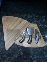 Swiss wedge-shaped cheese board with cheese tools