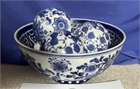 Blue and white decorative bowl with 3 balls