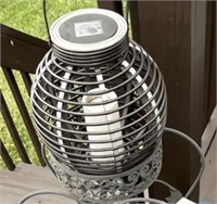 Wrought iron plant stand w/solar lamps