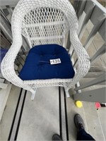 white wicker rocker and table