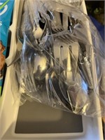 Assortment of kitchen items - utensils, silverware
