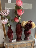 3 red vases w/flowers