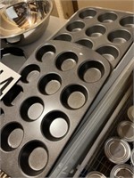 2 cupcake pans - 1 w/lid, stainless bowls,