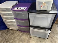 3 plastic storage shelves and 3 plastic containers