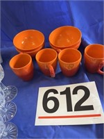 Orange/red bowls and mugs, white mugs,