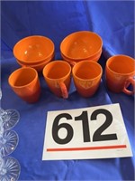 Orange/red bowls and mugs, white mugs,