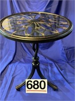 Glass topped metal table