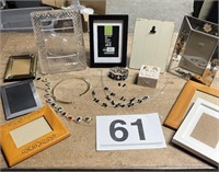 Assortment of picture frames, costume jewelry and