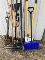 Assortment of lawn tools and garden hose