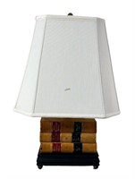 STACK OF LEATHER BOOKS  TABLE / DESK  LAMP