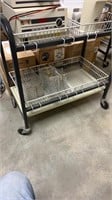 Rolling cart with baskets . Equipment not