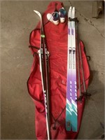 Cross country skiis. 74 and 77” long. Poles