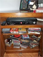 Vhs DVD player w/collection of cds and dvds