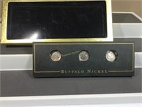 Three Buffalo nickels in display