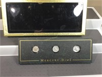 Three Mercury dimes in display