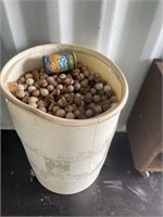 Barrel full of golf balls,