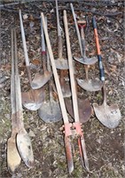 9 spade shovels and 2 post hole diggers; as is