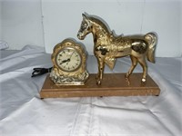 UNITED SELF STARTING CLOCK WITH HORSE