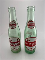 2 ACL  Dr. Pepper Bottles with different backs