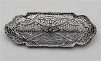 Silvertone filigree rhinestone brooch